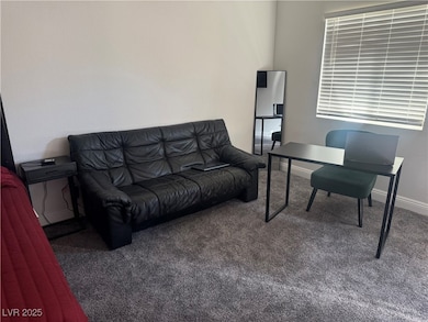 Home office featuring carpet flooring and baseboards