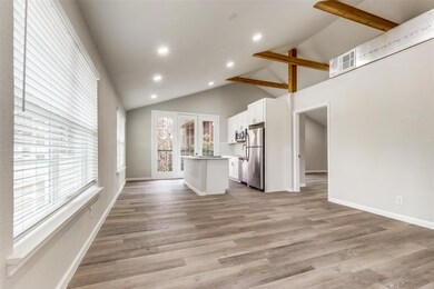 Unfurnished living room featuring high vaulted cei