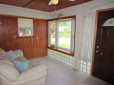 The Sun Porch has a bay window and has enough room