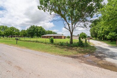 View of dirt / gravel road featuring a view of countryside