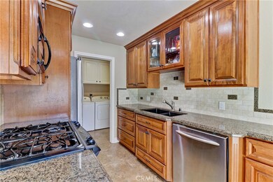 Notice laundry room which leads to direct access 2-car garage.  Laundry room cabinets have been upgraded also.