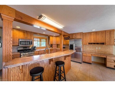 Kitchen with stainless steel appliances, breakfast