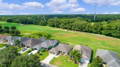 Back view overlooking golf course and tree buffer