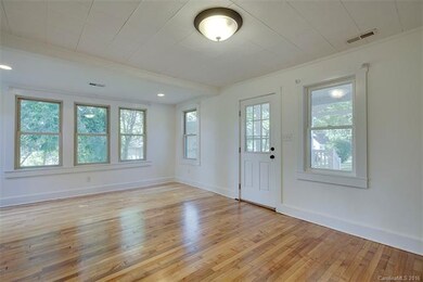spacious living room opens onto front porch
