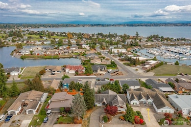 Great views, lot of parking. See parking just before the garage on the right. Also, if you take out landscaping on the left as you look at this picture it opens up RV or Boat parking.