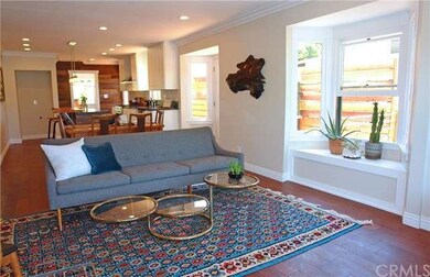 Crown molding, recessed lighting, and living room 