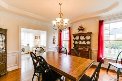 Formal Dining Room has tray ceiling, chandelier an