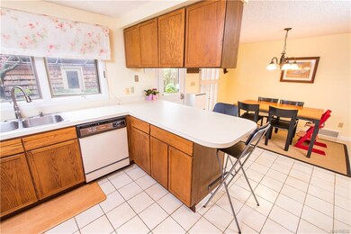 Kitchen measuring 12 x 11 with view of dining area