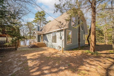 View of side of property featuring a chimney
