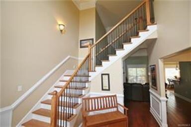 Enter in this grand foyer with winding stairway.