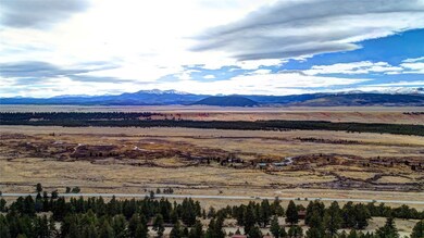View of mountain backdrop featuring rural landscape