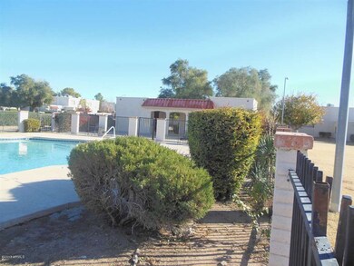 Fenced Community Pool & Sitting Area