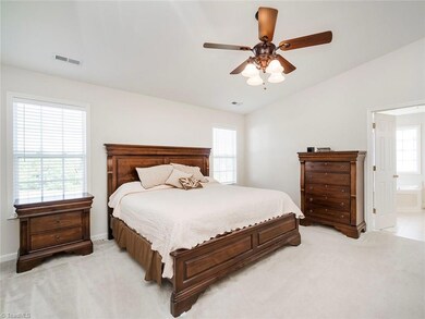 Master bedroom with vaulted ceilings and spacious master bath.