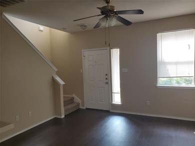 Foyer entrance with dark wood-type flooring, stai