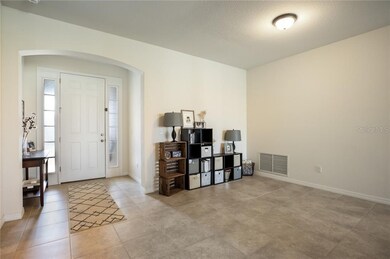 Foyer and dining room with beautiful tile througho