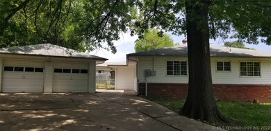 Side/Back entry to house with large detached garag
