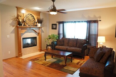 The living room is spacious boasting a fireplace a