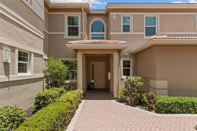 Property entrance with stucco siding and a tile ro