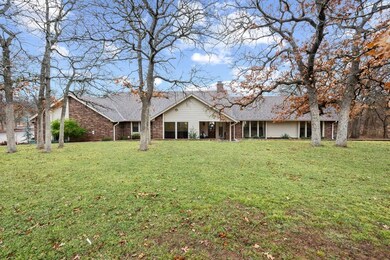 Back of property featuring a yard