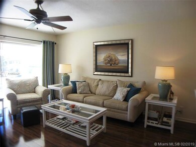 Living with wall to wall windows and access to large patio