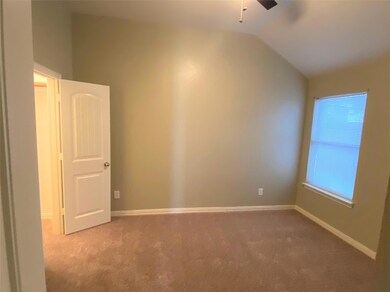 Unfurnished room with carpet flooring, lofted ceiling, and ceiling fan