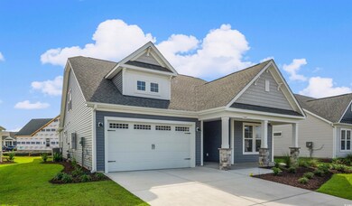 Craftsman-style home featuring roof with shingles, a porch, concrete driveway, a garage, and a front lawn