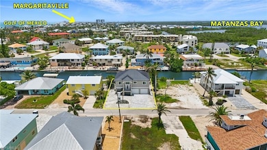 Live the dream coastal lifestyle! Enjoy unparalleled proximity to the bay, gulf, and all the fun of Margaritaville- Virtually Edited Image
