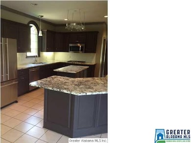 The Kitchen Has A Large Prep Island, Custom Cabine