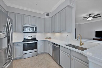 Updated kitchen with soft gray cabinets, beautiful Quartz counters and farm sink.