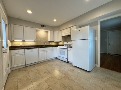Fully equipped kitchen with backdoor access to par