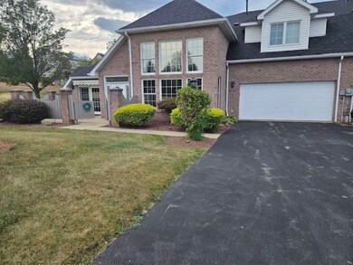 Two car garage with ample driveway parking.