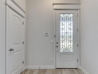 Entrance foyer featuring light hardwood / wood-sty