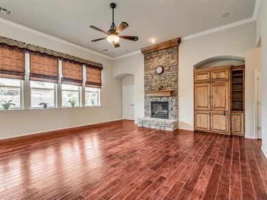 Unfurnished living room with ceiling fan, a firepl