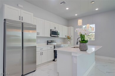 Kitchen with appliances with stainless steel finis