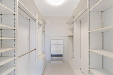 Walk-in master bedroom closet.