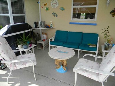 Exterior Back. Covered area of pool patio for thos