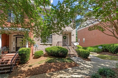 Obstructed view of property with brick siding