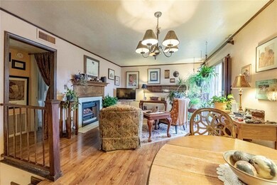 Dining space with an inviting chandelier, hardwood