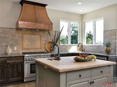 Custom copper hood, cooper prep sink in island and