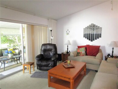 Living room/Dining room combination has carpeted f