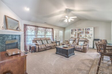Large, open living space with fireplace and built