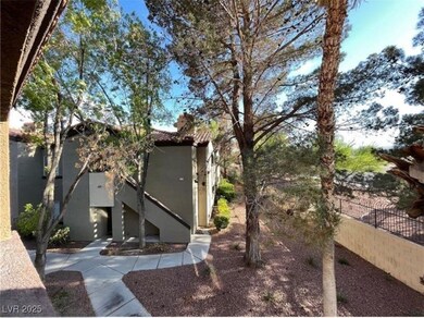 View of yard with fence and stairway