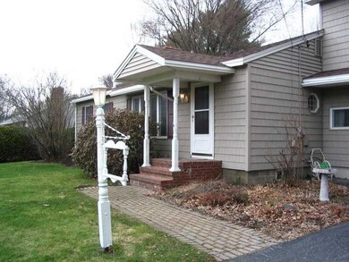Exterior Front. A brick walk leads...