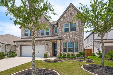 Two-car garage and manicured land scaping on a spa