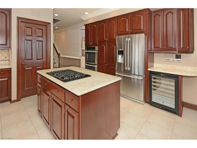 Additional kitchen features include walk-in pantry, wine fridge, intercom system and access to second stairway