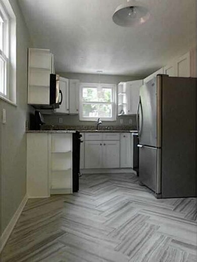 Kitchen. Porcelain ceramic tile in herring bone pa