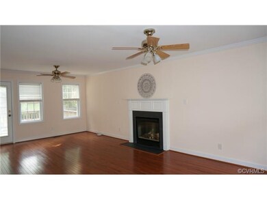 Brand new hardwood floors in this warm great room.