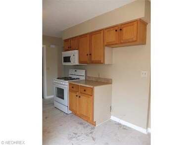 Applianced kitchen with oven, range, microwave and