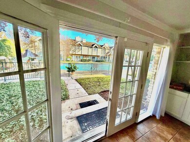Living room has open view of the swimming pool.