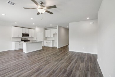 Kitchen with white cabinetry, stainless steel appl